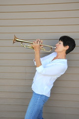 Mature female trumpet player.