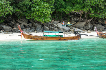 Fototapeta na wymiar Traditional longtail boat in bay on Phi Phi Island, Krabi