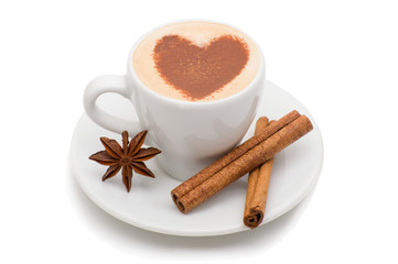 white cup of coffee in the form of heart with cinnamon sticks