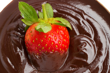 strawberries in chocolate syrup dessert on white background