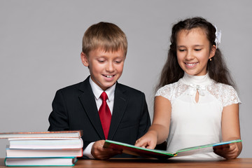 Boy and girl at the desk with books