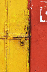 Vintage front door and red wall in India