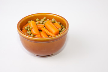 Bowl of boiled carrots and green peas