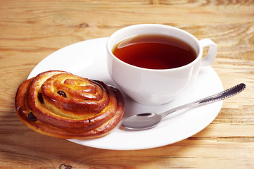Fresh bun and cup of tea