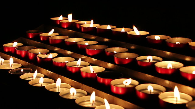 Burning candles in a church N6