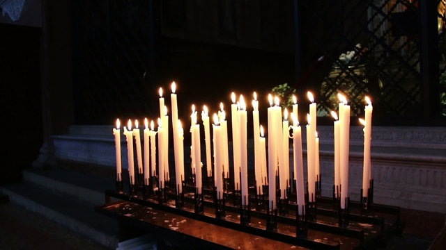 Burning candles in a church N4
