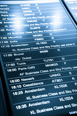 Obraz premium Flight arrival and departure sign board in airport