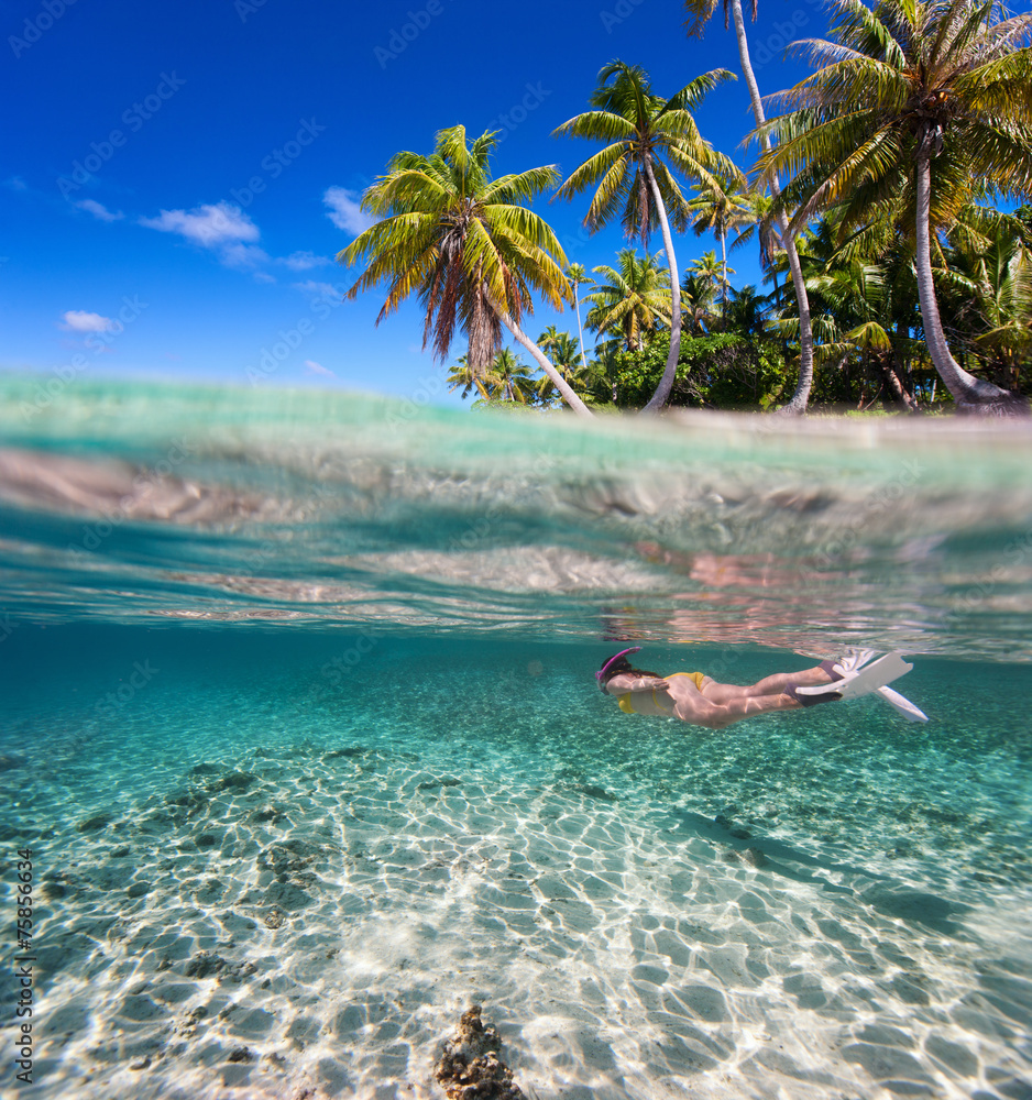 Poster woman swimming underwater