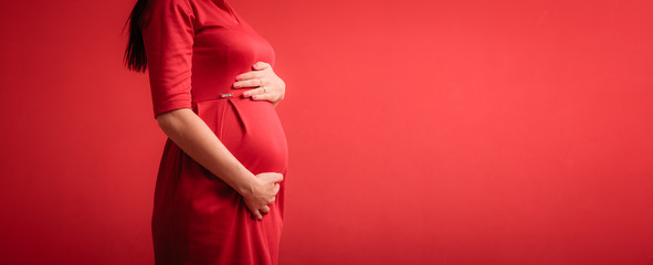 Closeup on tummy of pregnant woman