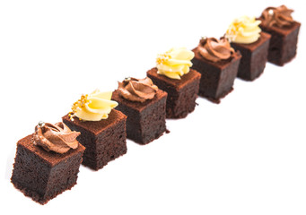 Bite sized chocolate cake with chocolate and cream cheese icing