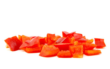 Chopped red pepper on white background.