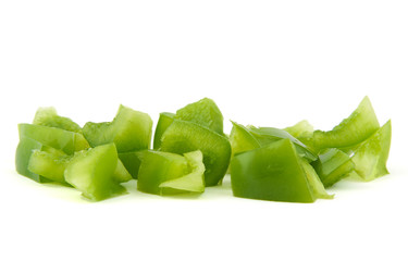 Chopped green pepper on white background.