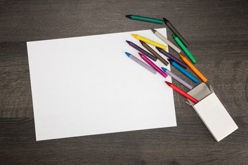 White blank paper with crayons