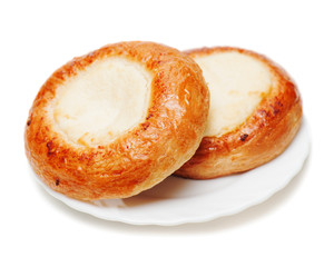 Fresh buns muffins with cottage cheese on white background.