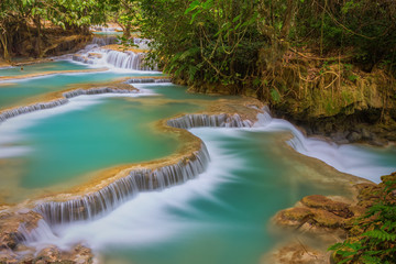Kuang Si waterfall with blue minerals water