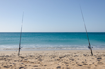 Two fishings rods at the beach