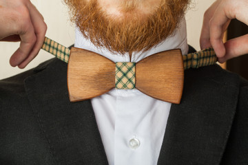 Fragment man suit hipster wooden bow tie on the shirt.
