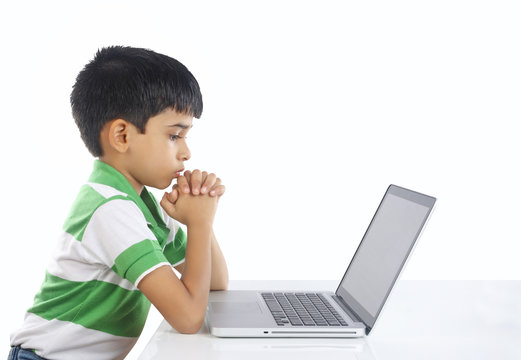 Indian Boy Praying with Laptop