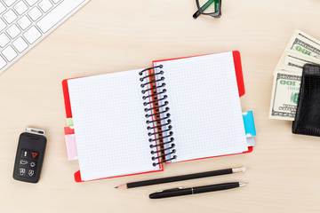 Office table with pc, supplies and money cash