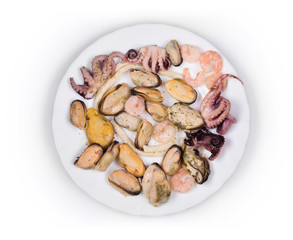 Tasty seafood on the round plate.