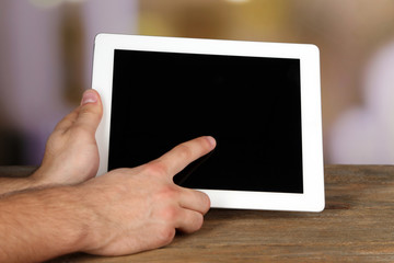 Hands holding tablet PC