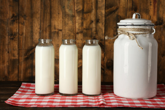 Milk can with glass bottles