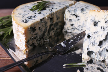 Blue cheese with sprigs of rosemary and blade