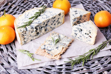 Blue cheese with sprigs of rosemary and oranges