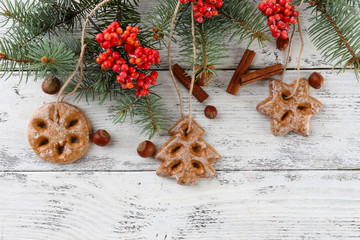 Cookies on rope on color wooden background