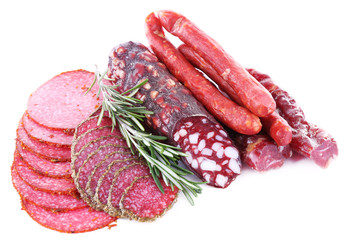 Assortment of smoked sausages isolated on white