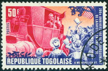 stamp printed by Togo, shows Lafayette arriving in Montpelier