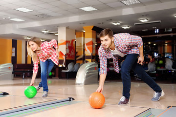 Friends playing in bowling club