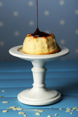 Delicious cheesecake on table, on color background