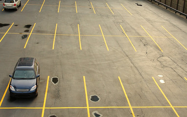 Aerial view of a parking lot with cars