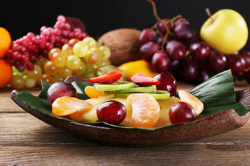 Fruit dessert on green leaf on table