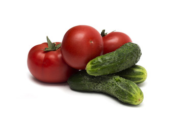 Red tomato and green cucumber. Photo.