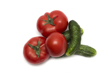 Red tomato and green cucumber. Photo.