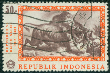 stamp printed in Indonesia shows "A Fight to the Death"