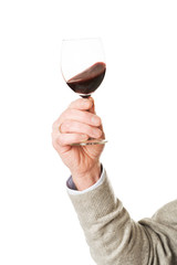Close up on male hand holding a glass of wine