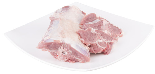 lamb chopped at cutlets. in white dish. isolated.