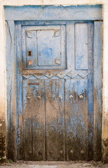 Entire old blue painted wooden door and lock