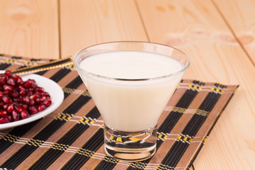 Milk with grains of pomegranate