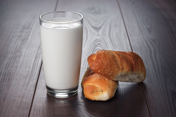 glass of milk and fresh buns