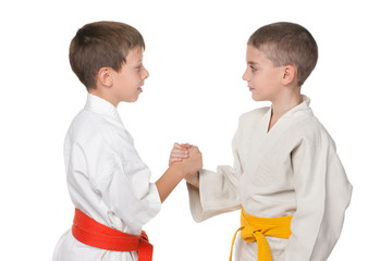 Handshaking of two boys in kimono