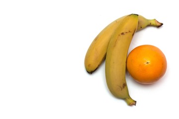 Banana and orange on a white background. Photo.