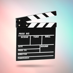 Fototapeta na wymiar Film Clapboard on cinematic background