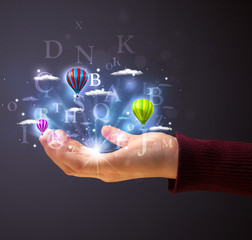 Letters and balloons in the hand of a woman