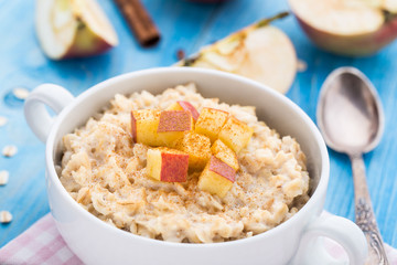 Tasty oatmeal with apples and cinnamon