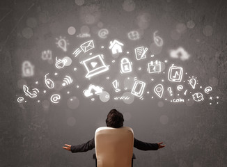 Business man looking at modern icons and symbols