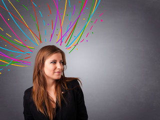Young girl thinking with colorful abstract lines overhead